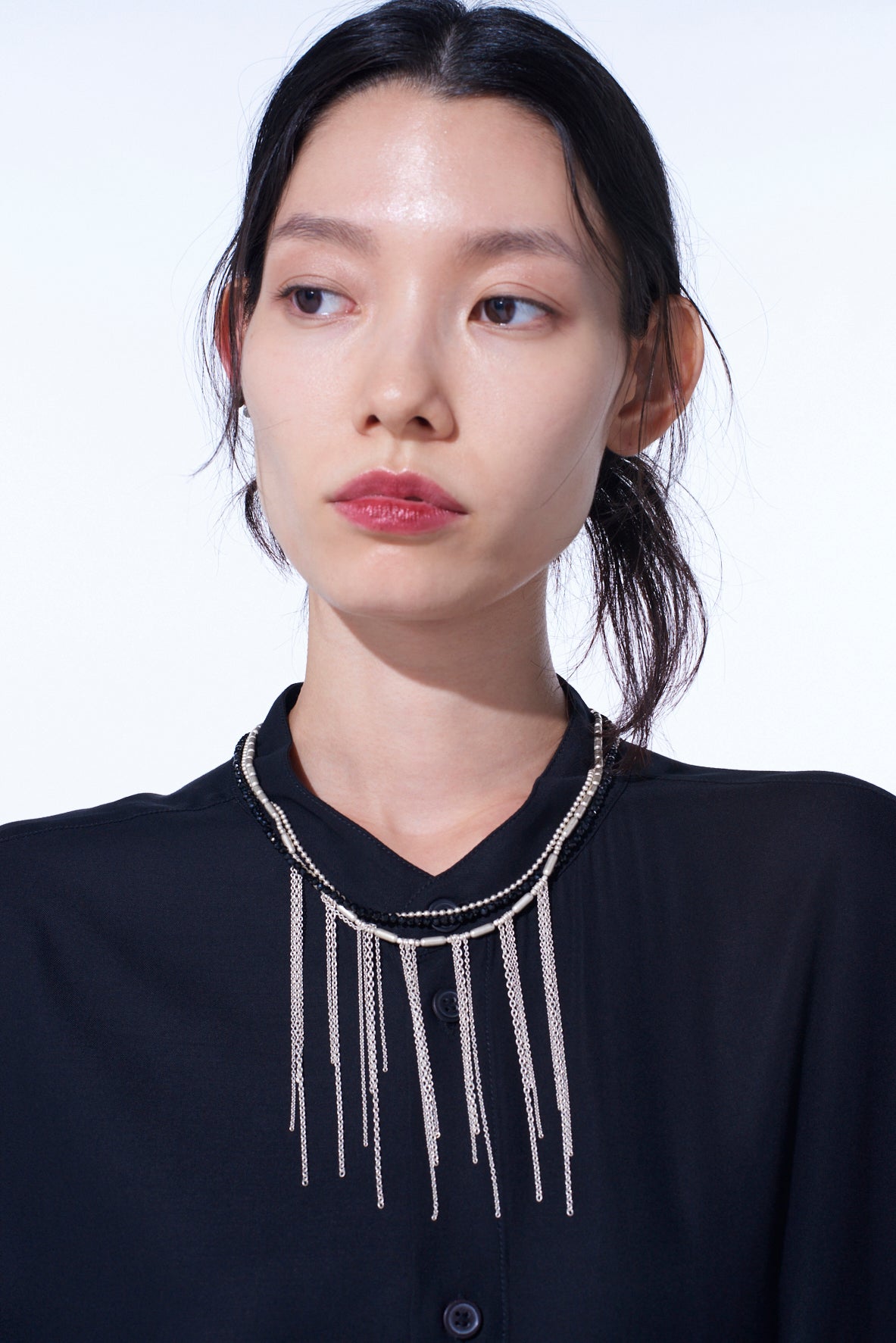 ONYX AND BRASS TASSEL LAYERED NECKLACE