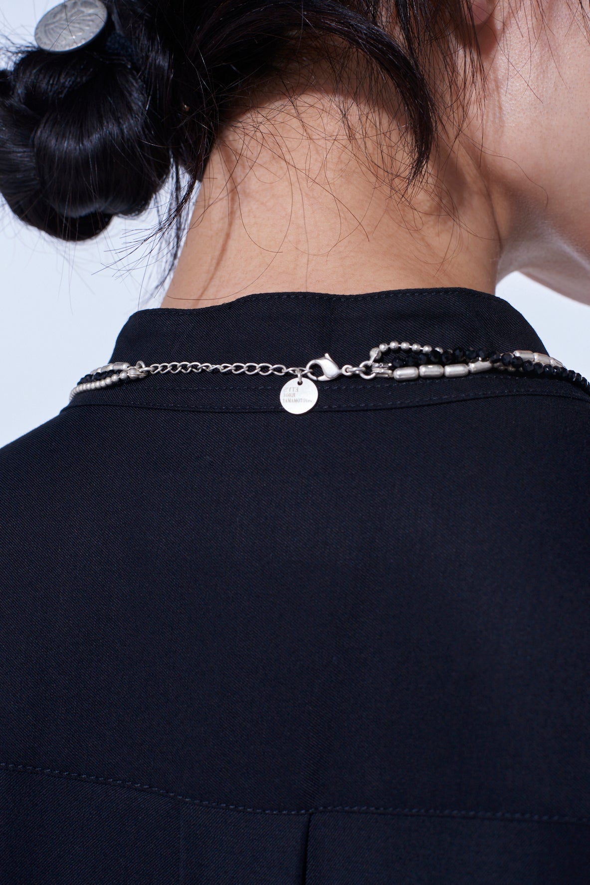ONYX AND BRASS TASSEL LAYERED NECKLACE