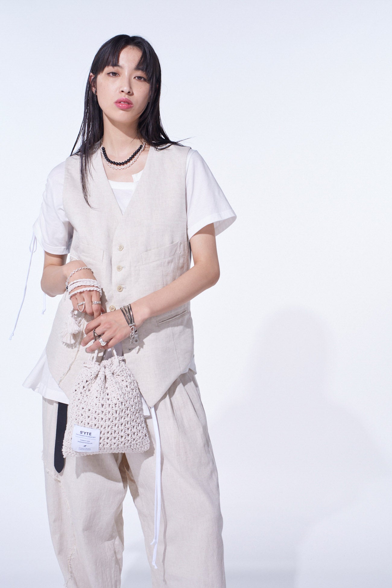 KNITTED DRAWSTRING MINI BAG