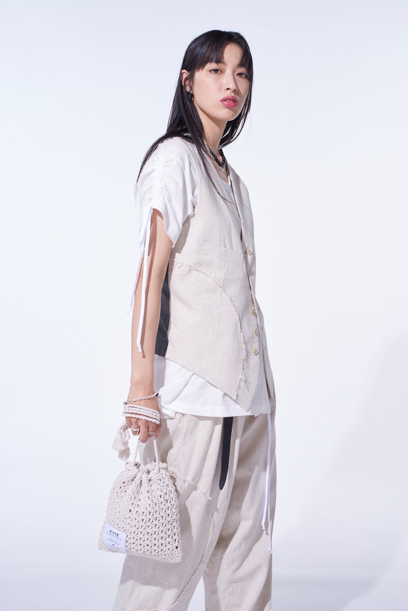 KNITTED DRAWSTRING MINI BAG