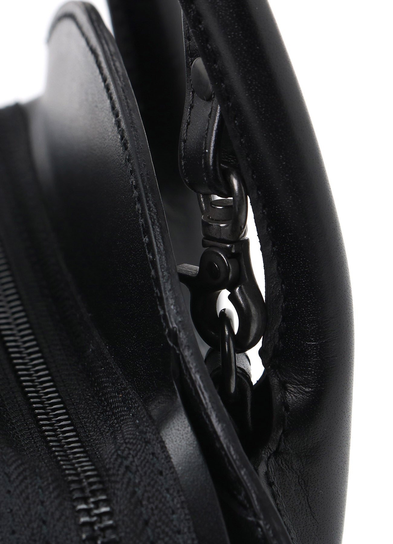 SEMI-GLOSS LEATHER CHOPPED ROUND BAG