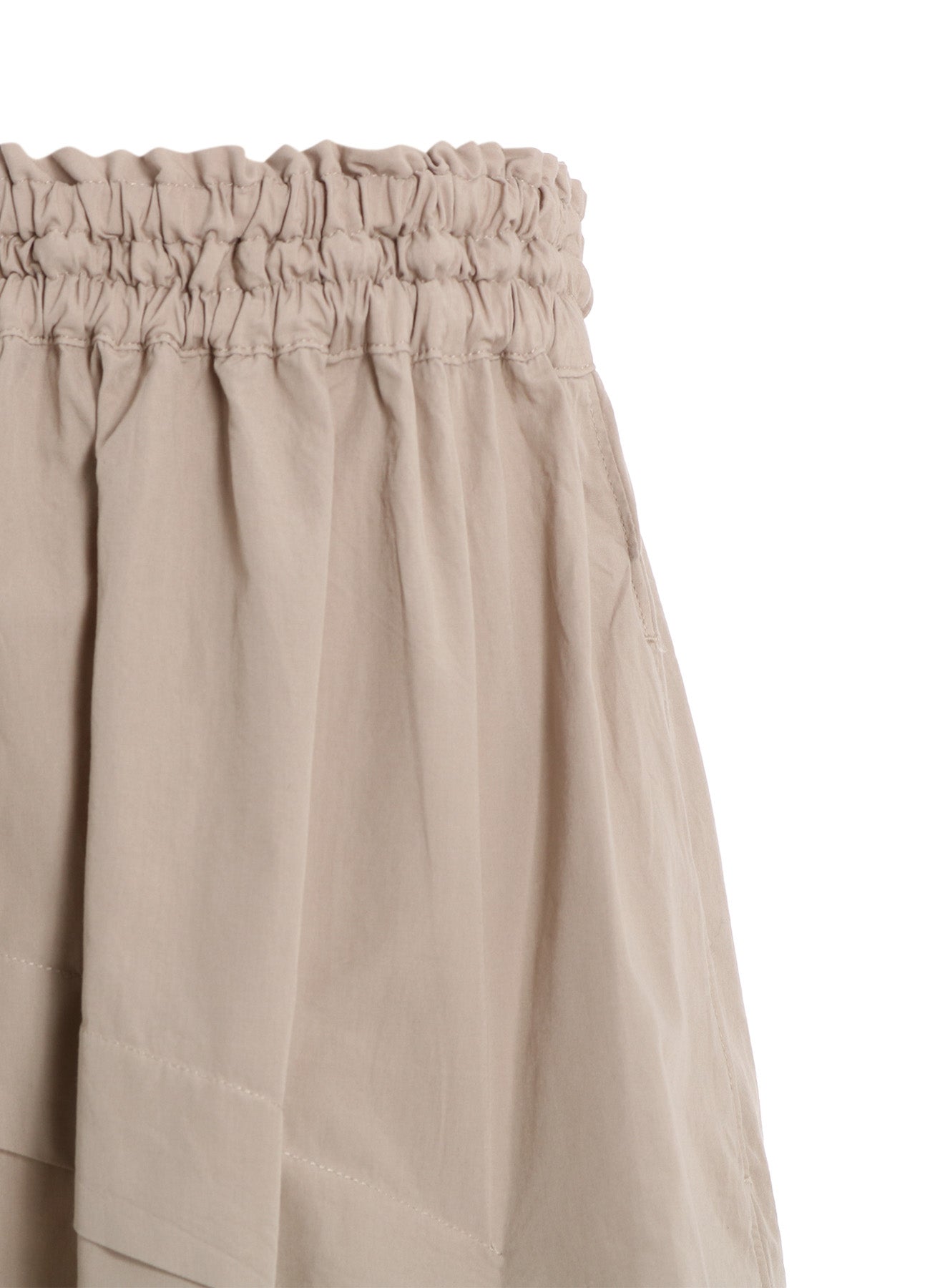 COTTON BROAD GARMENT DYEING RIGHT TUCKED ASYMMETRIC SKIRT