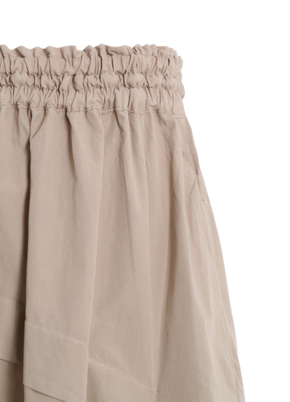 COTTON BROAD GARMENT DYEING RIGHT TUCKED ASYMMETRIC SKIRT