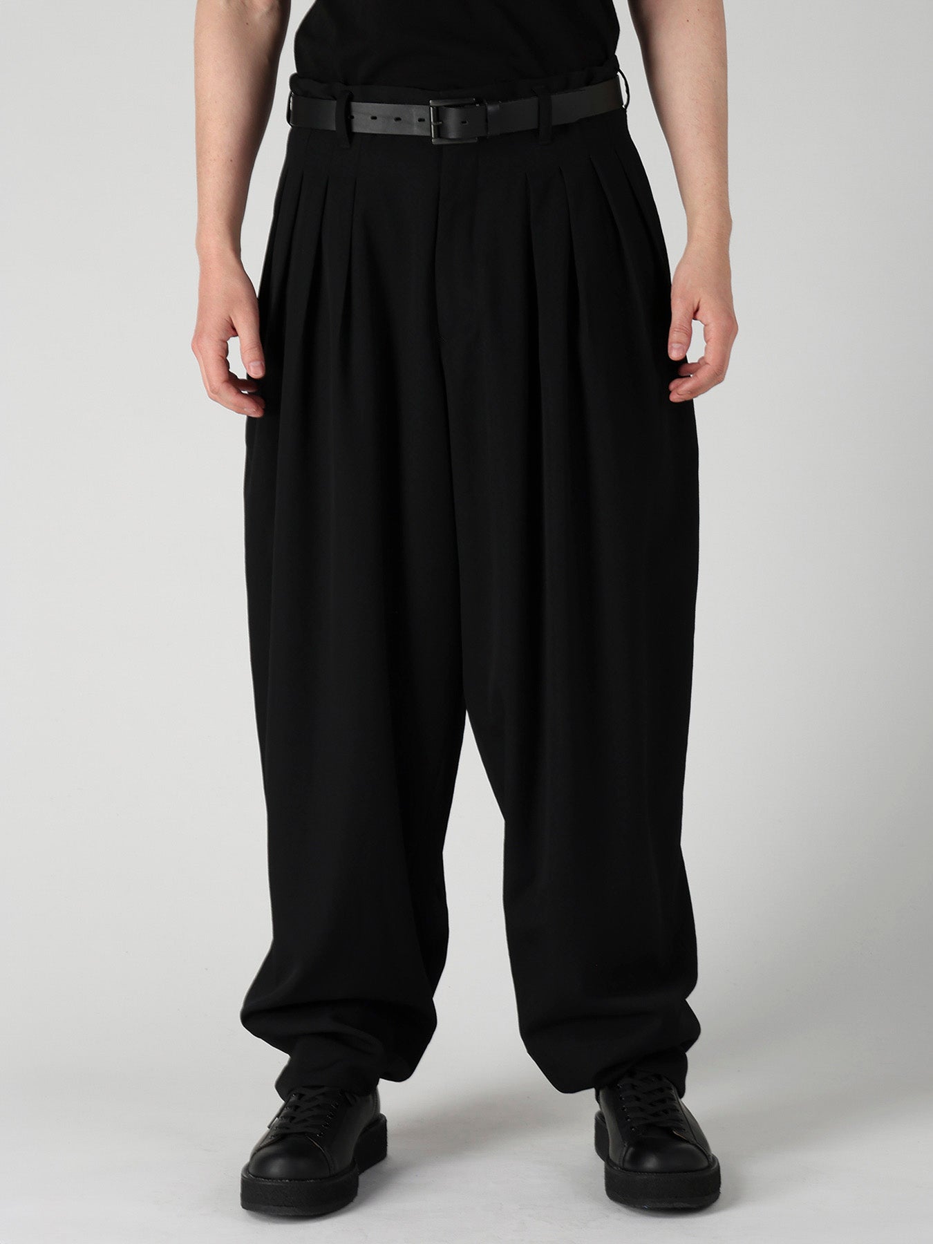 WOOL GABARDINE 16 TUCKS STACKED HEM PANTS