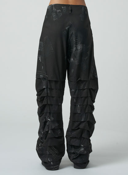 NEWSPAPER PRINT PANTS WITH HORIZONTAL PLEATS