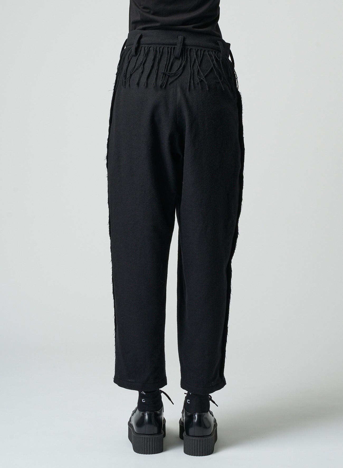 PLEATED SERGE PANTS WITH FRINGE DETAILS