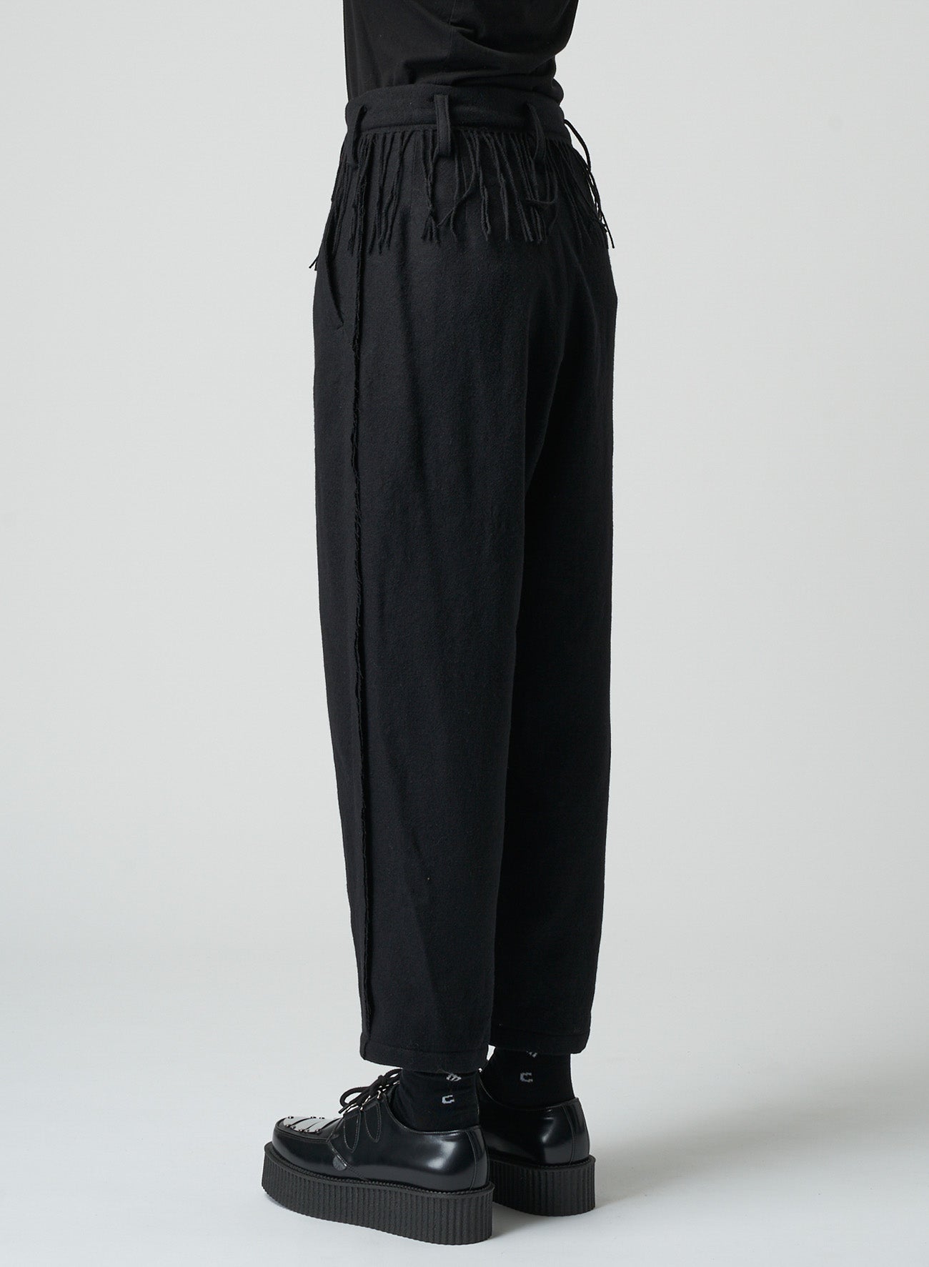 PLEATED SERGE PANTS WITH FRINGE DETAILS