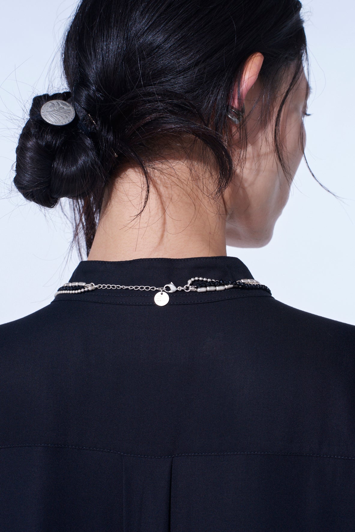 ONYX AND BRASS TASSEL LAYERED NECKLACE