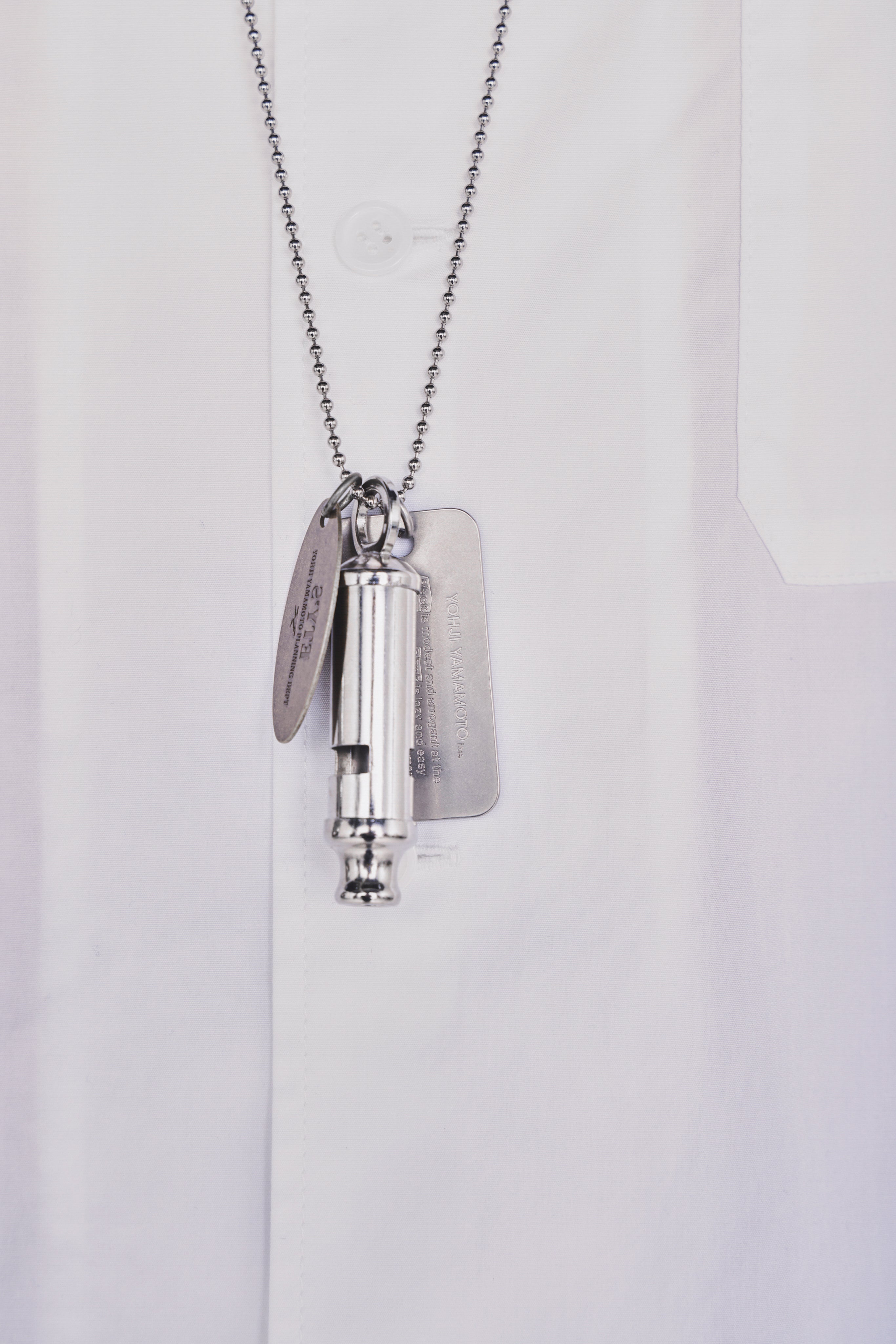 STAINLESS STEEL WHISTLE NECKLACE WITH BRASS TAG – THE SHOP YOHJI