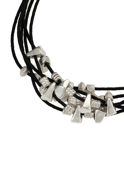 BRAIDED LEATHER BRACELET WITH BRASS CONES