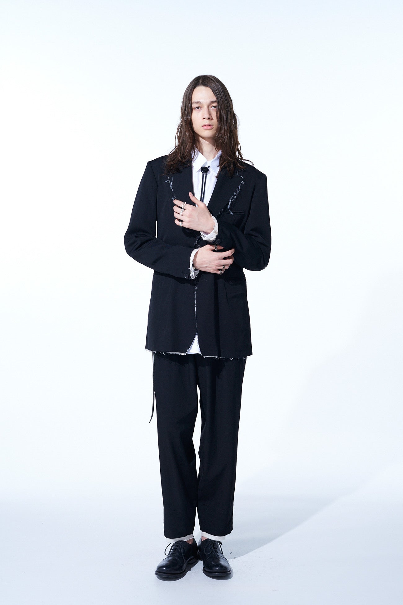 WASHER FINISHED WOOL GABARDINE 2-TUCK PANTS WITH CUT-OUT HEM DESIGN