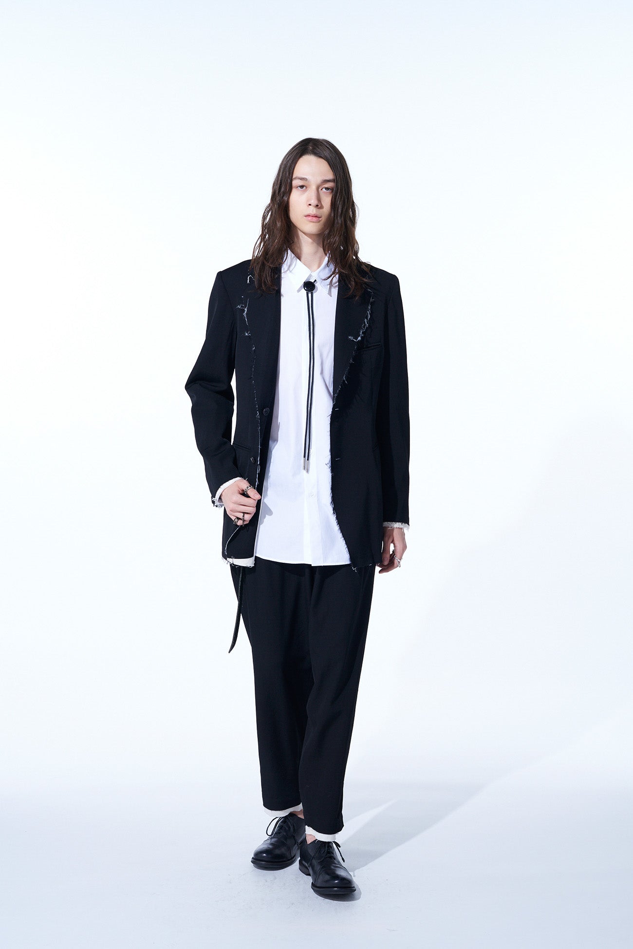 WASHER FINISHED WOOL GABARDINE 2-TUCK PANTS WITH CUT-OUT HEM DESIGN