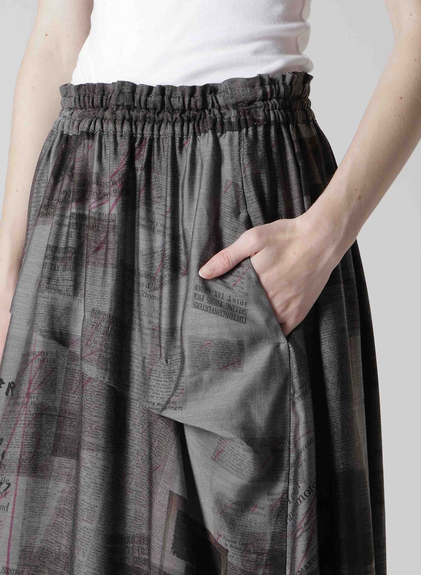 CUPRO DUNGAREE TWILL NEWSPAPER PRINT ASYMMETRIC SKIRT